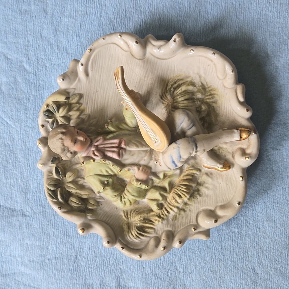 Very vintage, made in occupied japan hand painted, its got a number on back